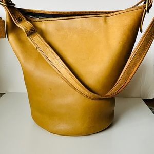 Coach Vintage 1970’s Feed sac Shoulder Bag in yellow saddle.